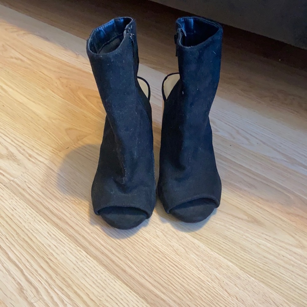 Open heel, open toe black boots with a gold heel